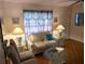 Comfortable living room with parquet flooring and beach themed decor at 1790 Pomelo Dr, Venice, FL 34293