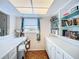 Well-lit home office includes built-in shelving and ample storage space at 1790 Pomelo Dr, Venice, FL 34293