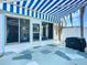 Enclosed outdoor patio with awning, exterior door and tiled floor at 1790 Pomelo Dr, Venice, FL 34293