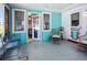 Enclosed outdoor patio with colorful decor and seating at 1790 Pomelo Dr, Venice, FL 34293