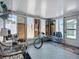 Enclosed sunroom with various seating options, a bike, and natural light at 1790 Pomelo Dr, Venice, FL 34293