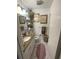 Bright bathroom featuring a granite vanity, decorative mirror, and stylish fixtures at 3307 W Saint John St, Tampa, FL 33607