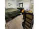Cozy bedroom featuring neutral flooring, dark furniture, and natural light, creating a comfortable and inviting space at 3307 W Saint John St, Tampa, FL 33607