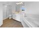 Bathroom with a soaking tub, shower, vanity, and modern fixtures at 5154 51St W Ln, Bradenton, FL 34210