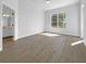 Bright bedroom with large window, neutral walls, and an ensuite bathroom at 5154 51St W Ln, Bradenton, FL 34210