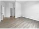 Spacious bedroom with neutral walls and modern flooring, leading to closets and other areas of the home at 5154 51St W Ln, Bradenton, FL 34210