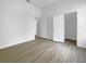 Bedroom with modern floors and neutral walls, connected to additional rooms and closet spaces at 5154 51St W Ln, Bradenton, FL 34210