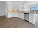 Modern kitchen with sleek cabinets, stainless steel appliances, and a breakfast bar at 5154 51St W Ln, Bradenton, FL 34210