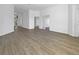 Spacious living area showcasing neutral paint and light wood floors throughout at 5154 51St W Ln, Bradenton, FL 34210