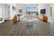 Bright living room features contemporary furnishings, stylish decor, and a large window with a view at 5154 51St W Ln, Bradenton, FL 34210
