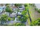 Aerial view of home showcasing a backyard pool and landscaping in a residential neighborhood at 7490 Locust Ne St, St Petersburg, FL 33702