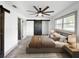 Cozy bedroom with a comfortable bed, rustic barn door, and ample natural light at 7490 Locust Ne St, St Petersburg, FL 33702