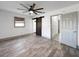 The bedroom features a ceiling fan, updated flooring, fresh paint, and a barn door at 7490 Locust Ne St, St Petersburg, FL 33702