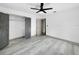 Clean bedroom design features new flooring, fresh paint, and a modern closet at 7490 Locust Ne St, St Petersburg, FL 33702