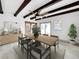 Dining room featuring wood beams, ceiling fan, and a wooden table with decorative centerpiece at 7490 Locust Ne St, St Petersburg, FL 33702