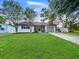 Charming single-story home features a well-manicured lawn and inviting curb appeal at 7490 Locust Ne St, St Petersburg, FL 33702