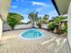 Backyard pool with brick pavers and landscaping at 7490 Locust Ne St, St Petersburg, FL 33702