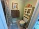 Cozy bathroom with a shower, toilet, and storage cabinet for an efficient space at 129 Caryl Way # 129, Oldsmar, FL 34677