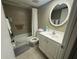 Bathroom featuring a vanity, a sink, a mirror, and a shower with curtain at 129 Caryl Way # 129, Oldsmar, FL 34677