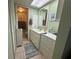 Bright bathroom featuring vanity with drawers, a large mirror, and a well-lit space at 129 Caryl Way # 129, Oldsmar, FL 34677