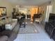 Inviting living room featuring a comfortable sofa, tiled floors, and a bright, open layout at 129 Caryl Way # 129, Oldsmar, FL 34677