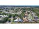 Aerial view of a neighborhood featuring mature trees and a road running through the community at 1369 Brookside Dr, Venice, FL 34285