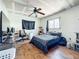 Cozy bedroom with ceiling fan and wood floor at 1369 Brookside Dr, Venice, FL 34285
