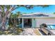 Exterior of home showing covered entrance to the property and access to the attached garage at 1369 Brookside Dr, Venice, FL 34285