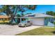 Inviting single-story home with a spacious driveway, attached garage, and a well-manicured lawn at 1369 Brookside Dr, Venice, FL 34285