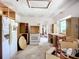 Open kitchen needing renovation with existing appliances and cabinetry, offering potential for customization at 1369 Brookside Dr, Venice, FL 34285