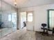View of the living room showing entrance to a covered porch and access to an adjacent room at 1369 Brookside Dr, Venice, FL 34285