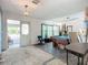 Spacious living room with an open doorway and large windows at 1369 Brookside Dr, Venice, FL 34285
