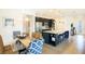 Open-concept kitchen with stainless steel appliances, a granite-topped island, and a dining area at 2185 Sulstone Dr, Punta Gorda, FL 33983