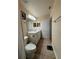 Bright bathroom with a white vanity, modern lighting and tile floors at 22227 Elmira Blvd, Port Charlotte, FL 33952