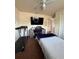 Bedroom featuring a bed, desk area, ceiling fan, and carpeting at 22227 Elmira Blvd, Port Charlotte, FL 33952