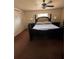 Bedroom featuring a bed, ceiling fan, bedside tables, lamps and carpeting at 22227 Elmira Blvd, Port Charlotte, FL 33952