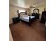 Bedroom featuring a bed, ceiling fan, bedside tables, lamps, carpeting and dressers at 22227 Elmira Blvd, Port Charlotte, FL 33952