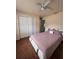 Spacious bedroom with closet, ceiling fan, and comfortable bed, perfect for relaxation at 22227 Elmira Blvd, Port Charlotte, FL 33952