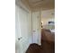 Hallway with a view of the living room, showing flooring and neutral colors at 22227 Elmira Blvd, Port Charlotte, FL 33952