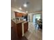 Well-lit kitchen with wooden cabinets, granite countertops, and stainless steel appliances at 22227 Elmira Blvd, Port Charlotte, FL 33952