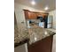 Spacious kitchen with granite countertops, wood cabinets, and modern appliances at 22227 Elmira Blvd, Port Charlotte, FL 33952