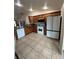 Bright, open kitchen with white appliances, wooden cabinets, and granite countertops at 22227 Elmira Blvd, Port Charlotte, FL 33952
