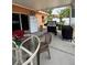 Outdoor patio with a table, grill, and refrigerator, perfect for entertaining at 22227 Elmira Blvd, Port Charlotte, FL 33952