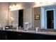 Modern bathroom featuring double sinks, granite countertops, and sleek fixtures for a luxurious experience at 32618 Rapids Loop, Wesley Chapel, FL 33545