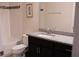 Well-lit bathroom features a granite vanity top, stylish fixtures, and tiled walls for a clean design at 32618 Rapids Loop, Wesley Chapel, FL 33545