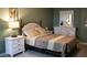 Comfortable bedroom with neutral tones, decorative lamps, and classic furniture creates a restful ambiance at 32618 Rapids Loop, Wesley Chapel, FL 33545