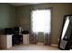 Cozy spare bedroom with a functional desk setup, bright window, and ample space for work or study at 32618 Rapids Loop, Wesley Chapel, FL 33545