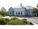 Charming community clubhouse with a welcoming entrance and beautifully landscaped surroundings at 32618 Rapids Loop, Wesley Chapel, FL 33545
