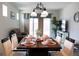 Inviting dining area with a beautifully set table, connecting to a cozy living room at 32618 Rapids Loop, Wesley Chapel, FL 33545