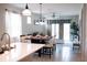 Elegant dining area featuring a stylish table setting and seamless flow to the living space at 32618 Rapids Loop, Wesley Chapel, FL 33545